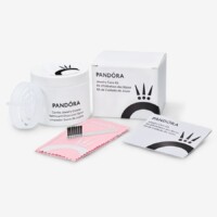 A box of makeup remover pads and a brush.