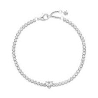 A diamond tennis bracelet with a heart shaped clasp.