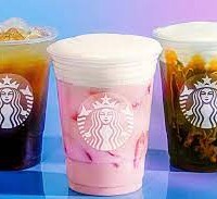 A group of starbucks drinks sitting on top of a table.